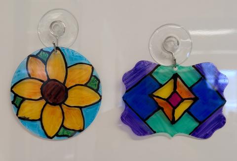 Suncatchers decorated with alcohol markers and 3D paint