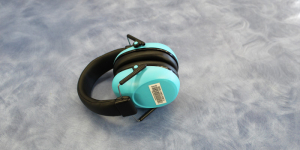 Teal and black noise cancelling headphones