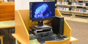 A computer on a small desk.